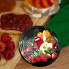 Deksel fi 82/6 fruit op zwarte achtergrond - 10 stuks - 6 ['doppen', ' potten', ' doppen voor jam', ' opslag', ' potdeksels', ' seizoensfruit', ' deksels voor potten', ' deksel fi 82', ' klikdoppen']