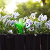 Plantengieter – groen blad met keramische voet, 120 ml - 9 ['plantengieter', ' gieter', ' gieter in de vorm van een blad', ' originele gieter', ' plantenbescherming', ' plantenverzorging', ' bloementuit', ' watergevend blad', ' watergevende bollen', ' watergevende bol', ' design gieter', ' hoe zorg je voor planten', ' mooie huisaccessoires', ' design gieters', ' unieke watergevende bollen', ' universele gieter', ' groene gieter', ' gieter voor kleine planten en kamerbloemen', ' keramische voet', ' keramische gieter', ' gieter met keramische voet']
